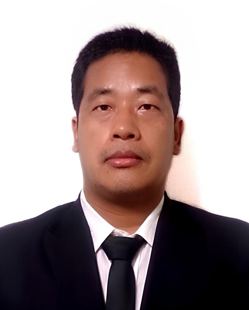 Portrait of Hastaraj Rai in a dark suit